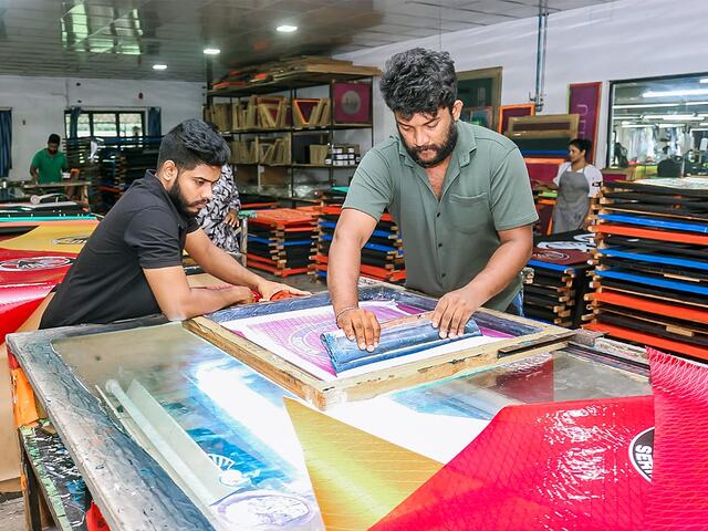 Pulling a screen print across a sail panel